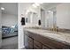 Bathroom featuring dual sinks with granite countertops and wooden cabinetry at 5736 Cadara Way, Parker, CO 80134