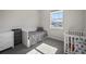 Bedroom featuring a window, neutral carpeting, and white furniture at 5736 Cadara Way, Parker, CO 80134