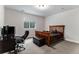 Bedroom with carpet, a wooden bed frame, a desk, and a window at 5736 Cadara Way, Parker, CO 80134