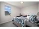Bedroom features plush bed, window with neighborhood view and neutral carpet at 5736 Cadara Way, Parker, CO 80134
