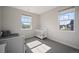 Bright bedroom with neutral colors and multiple windows offering neighborhood views at 5736 Cadara Way, Parker, CO 80134