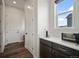Hall counter area features white quartz counters, and dark wood cabinets for storage at 5736 Cadara Way, Parker, CO 80134