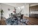 Dining area with modern table, stairway, and dark wood cabinets for added convenience at 5736 Cadara Way, Parker, CO 80134