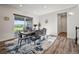 Light-filled dining area features a modern table with seating for six and sliding door to outdoor view at 5736 Cadara Way, Parker, CO 80134