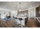 Spacious kitchen featuring a large island with seating and stainless steel appliances at 5736 Cadara Way, Parker, CO 80134