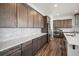 Modern kitchen boasts sleek countertops, stainless steel appliances, and stylish cabinets for culinary enthusiasts at 5736 Cadara Way, Parker, CO 80134