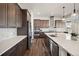 Well-equipped kitchen featuring stainless steel appliances, a center island, and plenty of storage at 5736 Cadara Way, Parker, CO 80134