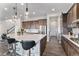 Spacious kitchen featuring a large island with a sink, stainless steel appliances, and ample cabinet space at 5736 Cadara Way, Parker, CO 80134