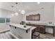 Kitchenette with granite countertops, wooden cabinets, pendant lights, and stainless steel appliances at 5736 Cadara Way, Parker, CO 80134
