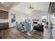 Spacious living room with vaulted ceilings, fireplace and dark wood flooring at 5736 Cadara Way, Parker, CO 80134