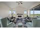 Inviting living room featuring vaulted ceilings, a modern fireplace, and ample natural light at 5736 Cadara Way, Parker, CO 80134