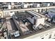 Aerial view of a rooftop deck with pergola, seating area, and stylish decor at 4062 W 16Th Ave, Denver, CO 80204