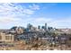 Expansive aerial view of the city skyline with modern architecture and stadium at 4062 W 16Th Ave, Denver, CO 80204