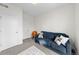 Bedroom featuring a blue sofa with decorative pillows, and an area rug at 4062 W 16Th Ave, Denver, CO 80204