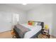 Cozy bedroom features a comfortable bed, colorful rug, and ample natural light at 4062 W 16Th Ave, Denver, CO 80204