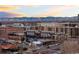 Urban community view with city buildings, parking, and distant mountain views at 4062 W 16Th Ave, Denver, CO 80204