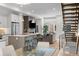 Bright open floor plan with modern kitchen, dining area, living room, and open staircase at 4062 W 16Th Ave, Denver, CO 80204