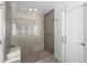 Modern shower featuring glass enclosure, built-in shelving, and stylish tile work at 4062 W 16Th Ave, Denver, CO 80204