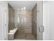 Modern shower featuring glass enclosure, built-in shelving, and stylish tile work at 4062 W 16Th Ave, Denver, CO 80204