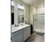 Clean bathroom with double sinks and a shower at 4680 Thistle Dr, Brighton, CO 80601