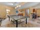 Basement featuring a ping pong table, track lighting, and access to other areas at 5090 S Perry Park Rd, Sedalia, CO 80135