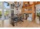 Dining room with chandelier, wood floors, and views of the surrounding property at 5090 S Perry Park Rd, Sedalia, CO 80135