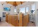 Hallway with wood trim, telescope, mounted TV, and a wooden planked ceiling at 5090 S Perry Park Rd, Sedalia, CO 80135