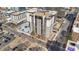 Aerial view of the high-rise building, surrounding streets, parking, and neighboring buildings at 2 Adams St # 608, Denver, CO 80206