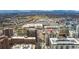 Sweeping aerial shot showing the building in relation to nearby retail and businesses within an urban landscape at 2 Adams St # 608, Denver, CO 80206