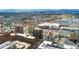 Aerial view showcases the building's location with views of cityscape, shopping, and mountain backdrop at 2 Adams St # 608, Denver, CO 80206