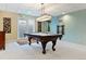 Well-lit billiards room with a classic pool table and ample space for entertainment at 2 Adams St # 608, Denver, CO 80206