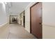 Inviting hallway with neutral carpet, elevator access, and easy access to the exit at 2 Adams St # 608, Denver, CO 80206