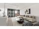 Bright living room featuring a large window and modern furnishings at 2 Adams St # 608, Denver, CO 80206