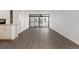 Spacious living room with wood-look floors, access to a large window and combined with an open kitchen space at 2 Adams St # 608, Denver, CO 80206