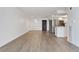 Light-filled living space features gray flooring with adjacent updated kitchen and stainless steel refrigerator at 2 Adams St # 608, Denver, CO 80206