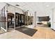 Bright, tiled lobby area with seating, glass entryway, and decorative details at 2 Adams St # 608, Denver, CO 80206