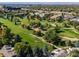 Aerial view of community with golf course and surrounding landscape at 3242 S Heather Gardens Way, Aurora, CO 80014