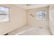 Spacious bedroom with carpeted flooring and two windows at 3242 S Heather Gardens Way, Aurora, CO 80014