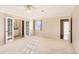 Bright bedroom with carpet flooring and two windows at 3242 S Heather Gardens Way, Aurora, CO 80014