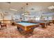 Game room with multiple billiard tables and comfortable seating at 3242 S Heather Gardens Way, Aurora, CO 80014