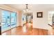 Bright dining room with hardwood floors and sliding glass doors leading to a patio at 3242 S Heather Gardens Way, Aurora, CO 80014