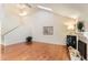 Spacious living room with hardwood floors, fireplace and vaulted ceiling at 3242 S Heather Gardens Way, Aurora, CO 80014