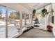 Sunroom with ample natural light and view of a snow-covered landscape at 3242 S Heather Gardens Way, Aurora, CO 80014