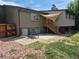 View of back exterior featuring a patio, stairs to upper level, and fenced yard at 2043 S Salida St, Aurora, CO 80013
