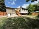 The property includes a backyard with a deck and stairs leading to the yard at 2043 S Salida St, Aurora, CO 80013