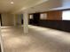 Expansive basement space featuring versatile layout, a brick fireplace and carpet at 2043 S Salida St, Aurora, CO 80013