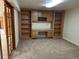 Finished basement featuring built-in desk and shelving, carpet floors at 2043 S Salida St, Aurora, CO 80013