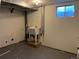 Basement with utility sink, concrete floor, exposed pipes, and a window at 2043 S Salida St, Aurora, CO 80013