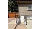 Exterior view of basement entrance featuring a secure stairwell and a fenced yard at 2043 S Salida St, Aurora, CO 80013