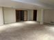 Open basement featuring neutral carpet and access to other rooms at 2043 S Salida St, Aurora, CO 80013